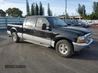2003 Ford Super Duty F-250 XL with VIN 1FTNW20P63ED04454, listed as a Copart auction lot 86355444 with 154,194 mi miles and Salvage Title. Bid and sale history available at carsss.com. Image 4.