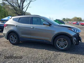 2018 Hyundai Santa Fe 2.4L z VIN 5NMZUDLB7JH077241, wystawiony jako IAAI lot #42135854 z przebiegiem 59 819 mil mil oraz . Historia ofert i sprzedaży dostępna na DreamBid. Obrazek 13.