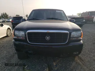 1999 Cadillac Escalade z VIN 1GYEK13R7XR405790, wystawiony jako Copart lot #84478384 z przebiegiem 244 195 mil mil oraz Szkody całkowita. Historia ofert i sprzedaży dostępna na DreamBid. Obrazek 5.