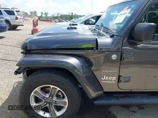 2022 Jeep Wrangler Unlimited Sahara Altitude z VIN 1C4HJXEG6NW103779, wystawiony jako IAAI lot #42563826 z przebiegiem 79 315 mil mil oraz . Historia ofert i sprzedaży dostępna na DreamBid. Obrazek 19.