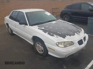 1998 Pontiac Grand Am SE2 with VIN 1G2NE52T7WM513702, listed as a IAAI auction lot 41503141 with 302,315 mi miles. Bid and sale history available at carsss.com. Image 1.