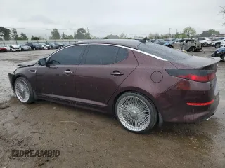 2014 Kia Optima EX with VIN 5XXGN4A79EG329448, listed as a Copart auction lot 50991095 with 103,879 mi miles and Salvage Title. Bid and sale history available at carsss.com. Image 2.