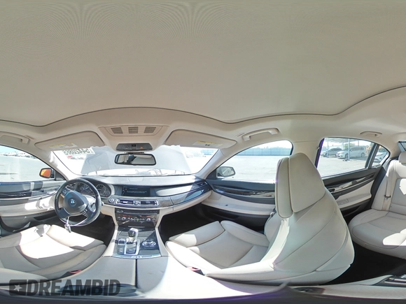 2012 BMW 7 Series 740i with VIN WBAKA4C54CC613419, listed as a Copart auction lot 54420885 with 104,006 mi miles and Salvage Title. Bid and sale history available at DreamBid. Image 14.