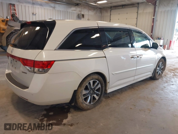 2015 Honda Odyssey Touring Elite with VIN 5FNRL5H97FB060060, listed as a IAAI auction lot 41829864 with Not Provided miles and . Bid and sale history available at DreamBid. Image 4.