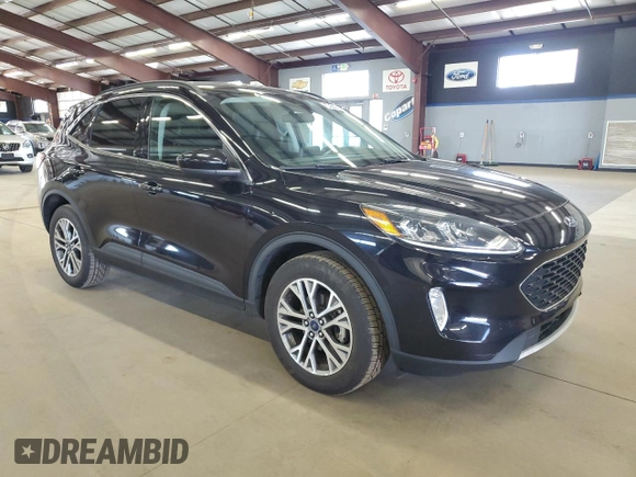2021 Ford Escape SEL with VIN 1FMCU9H64MUA50988, listed as a Copart auction lot 54517685 with 122,593 mi miles and Salvage Title. Bid and sale history available at DreamBid. Image 4.