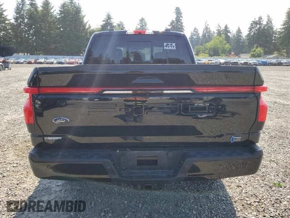 2023 Ford F-150 Lightning Pro with VIN 1FTVW1EV5PWG63666, listed as a Copart auction lot 60998415 with 35,089 mi miles and Salvage title. Bid and sale history available at DreamBid. Image 6.