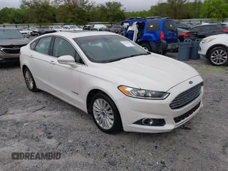 2014 Ford Fusion SE Hybrid with VIN 3FA6P0LU3ER312041, listed as a IAAI auction lot 41964588 with 138,566 mi miles and . Bid and sale history available at DreamBid. Image 1.