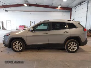 2014 Jeep Cherokee Latitude with VIN 1C4PJLCS1EW106004, listed as a IAAI auction lot 41786457 with 145,588 mi miles. Bid and sale history available at carsss.com. Image 14.