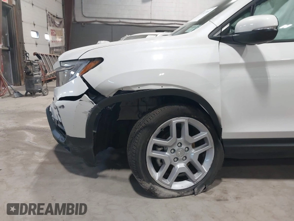 2025 Honda Passport EX-L z VIN 5FNYF8H5XSB017943, wystawiony jako IAAI lot #42027857 z przebiegiem 1 822 mil mil oraz . Historia ofert i sprzedaży dostępna na DreamBid. Obrazek 6.
