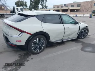 2022 Kia EV6 Wind with VIN KNDC34LA9N5043553, listed as a IAAI auction lot 41576789 with 133,401 mi miles and . Bid and sale history available at DreamBid. Image 4.
