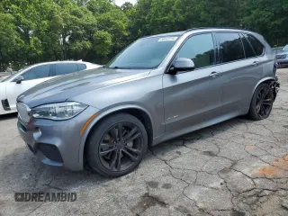 2014 BMW X5 xDrive50i with VIN 5UXKR6C57E0J72105, listed as a Copart auction lot 58442315 with 165,318 mi miles and Salvage title. Bid and sale history available at DreamBid. Image 1.