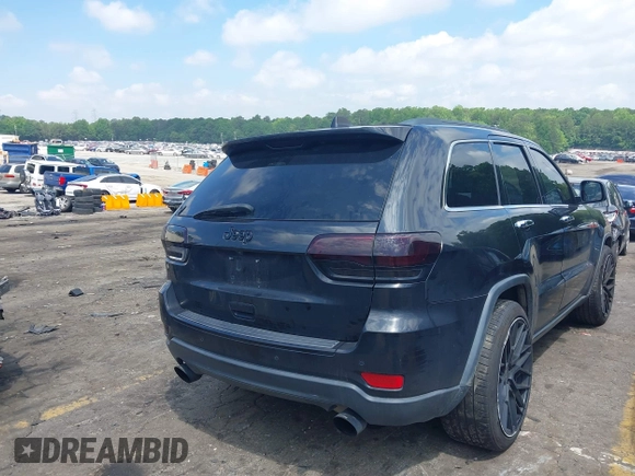 2014 Jeep Grand Cherokee Limited with VIN 1C4RJFBG3EC545861, listed as a IAAI auction lot 42216743 with 160,000 mi miles and . Bid and sale history available at DreamBid. Image 4.