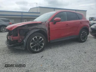 2016 Mazda CX-5 Grand Touring z VIN JM3KE4DYXG0808844, wystawiony jako Copart lot #54415255 z przebiegiem 98 737 mil mil oraz Szkoda całkowita • Salvage title. Historia ofert i sprzedaży dostępna na DreamBid. Obrazek 1.