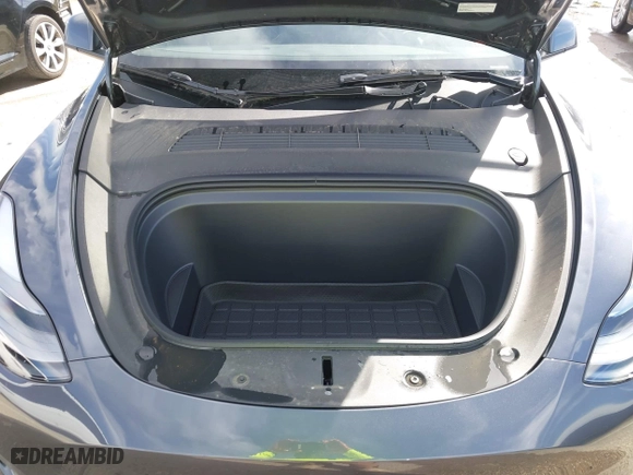 2023 Tesla Model Y Long Range with VIN 7SAYGDEE3PA204992, listed as a IAAI auction lot 41849104 with 22,490 mi miles. Bid and sale history available at carsss.com. Image 10.