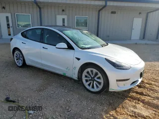 2022 Tesla Model 3 with VIN 5YJ3E1EA7NF184741, listed as a Copart auction lot 82487494 with 133,215 mi miles and Clean Title. Bid and sale history available at DreamBid. Image 4.