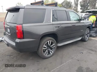 2015 Chevrolet Tahoe LT with VIN 1GNSCBKC1FR233898, listed as a IAAI auction lot 42004048 with 115,779 mi miles and . Bid and sale history available at DreamBid. Image 4.