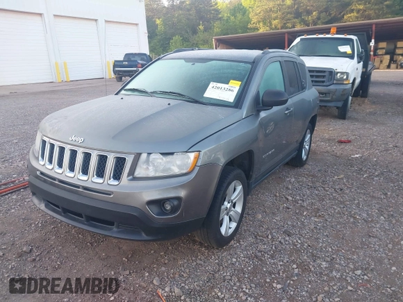 2011 Jeep Compass Latitude with VIN 1J4NT1FB4BD260158, listed as a IAAI auction lot 42013286 with 326,493 mi miles. Bid and sale history available at carsss.com. Image 2.