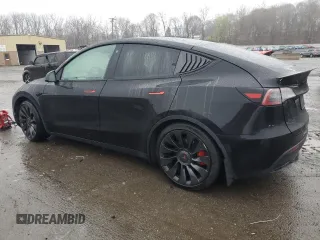 2022 Tesla Model Y Performance z VIN 7SAYGDEF9NF382883, wystawiony jako Copart lot #52028085 z przebiegiem 49 108 mil mil oraz Szkoda całkowita • Salvage title. Historia ofert i sprzedaży dostępna na DreamBid. Obrazek 2.
