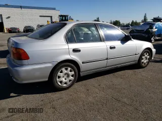 1999 Honda Civic LX with VIN 2HGEJ6571XH552867, listed as a Copart auction lot 81715654 with 234,544 mi miles and Salvage Title. Bid and sale history available at DreamBid. Image 3.