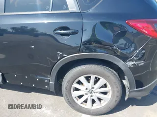 2014 Mazda CX-5 Sport z VIN JM3KE2BE8E0371775, wystawiony jako IAAI lot #42111417 z przebiegiem 150 932 mil mil oraz . Historia ofert i sprzedaży dostępna na DreamBid. Obrazek 6.