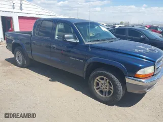 2002 Dodge Dakota SLT with VIN 1B7HL48N32S708719, listed as a IAAI auction lot 42027763 with 217,797 mi miles. Bid and sale history available at carsss.com. Image 1.