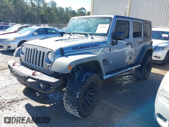 2015 Jeep Wrangler Unlimited Rubicon Hard Rock with VIN 1C4HJWFG2FL587607, listed as a IAAI auction lot 41419237 with 109,719 mi miles and . Bid and sale history available at DreamBid. Image 2.