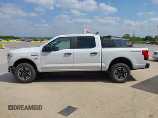 2023 Ford F-150 Lightning Pro with VIN 1FTVW1EL2PWG18764, listed as a IAAI auction lot 41908278 with 16,276 mi miles and . Bid and sale history available at DreamBid. Image 14.