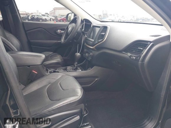 2014 Jeep Cherokee Limited with VIN 1C4PJLDS1EW148199, listed as a IAAI auction lot 42109290 with 167,505 mi miles and . Bid and sale history available at DreamBid. Image 5.