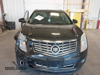 2014 Cadillac SRX Premium Collection z VIN 3GYFNGE38ES606731, wystawiony jako IAAI lot #41844450 z przebiegiem 156 541 mil mil oraz . Historia ofert i sprzedaży dostępna na DreamBid. Obrazek 12.