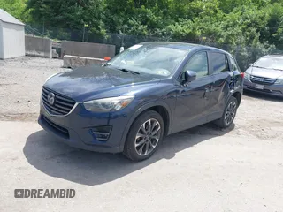 2016 Mazda CX-5 Grand Touring z VIN JM3KE4DY1G0817562, wystawiony jako IAAI lot #42289929 z przebiegiem 135 476 mil mil oraz . Historia ofert i sprzedaży dostępna na DreamBid. Obrazek 18.