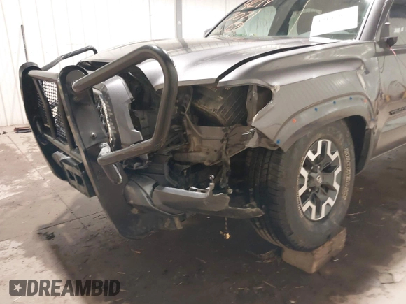 2019 Toyota Tacoma SR with VIN 5TFCZ5AN7KX208672, listed as a IAAI auction lot 42143071 with 83,584 mi miles and . Bid and sale history available at DreamBid. Image 6.