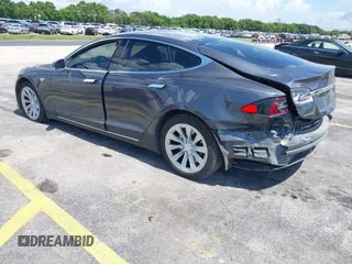 2016 Tesla Model S 70 with VIN 5YJSA1E16GF156312, listed as a IAAI auction lot 42469451 with 90,317 mi miles and . Bid and sale history available at DreamBid. Image 3.