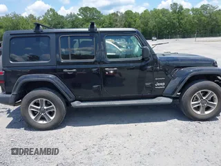 2021 Jeep Wrangler Unlimited Sahara with VIN 1C4HJXEN9MW681422, listed as a IAAI auction lot 42563426 with 48,582 mi miles and . Bid and sale history available at DreamBid. Image 13.