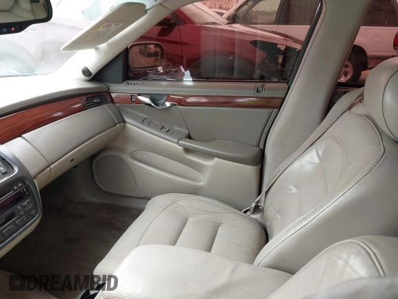 2003 Cadillac DeVille z VIN 1G6KD54Y63U223640, wystawiony jako IAAI lot #41704549 z przebiegiem 127 981 mil mil oraz . Historia ofert i sprzedaży dostępna na DreamBid. Obrazek 5.