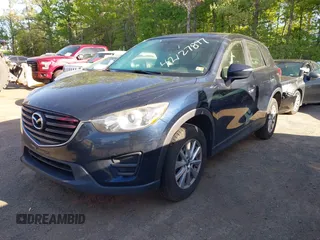 2016 Mazda CX-5 Sport with VIN JM3KE2BY3G0657904, listed as a IAAI auction lot 42127897 with 153,855 mi miles. Bid and sale history available at carsss.com. Image 17.