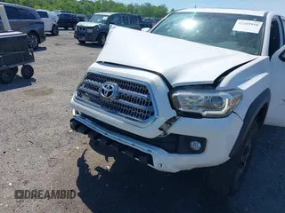 2016 Toyota Tacoma SR with VIN 3TMCZ5AN0GM003224, listed as a IAAI auction lot 42289910 with 140,899 mi miles and . Bid and sale history available at DreamBid. Image 6.