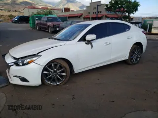 2018 Mazda 3 Touring z VIN 3MZBN1V39JM203256, wystawiony jako Copart lot #88093725 z przebiegiem Nie podano mil oraz Szkoda całkowita • Salvage title. Historia ofert i sprzedaży dostępna na DreamBid. Obrazek 1.