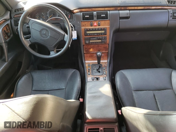 1998 Mercedes-Benz E-Class with VIN WDBJF65F1WA711193, listed as a Copart auction lot 76052034 with 168,935 mi miles and Salvage Title. Bid and sale history available at carsss.com. Image 8.