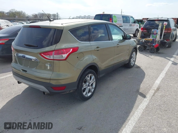 2013 Ford Escape SEL with VIN 1FMCU9H99DUC03956, listed as a IAAI auction lot 41891855 with 84,428 mi miles and . Bid and sale history available at DreamBid. Image 4.