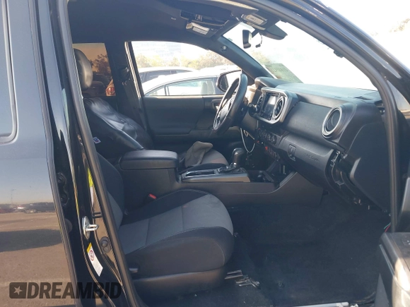 2019 Toyota Tacoma SR z VIN 5TFCZ5AN9KX199814, wystawiony jako IAAI lot #41841821 z przebiegiem 69 276 mil mil oraz . Historia ofert i sprzedaży dostępna na DreamBid. Obrazek 5.
