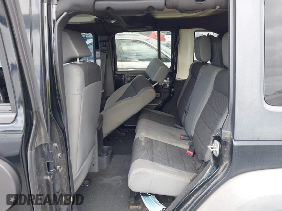 2007 Jeep Wrangler Unlimited X with VIN 1J4GB391X7L172965, listed as a IAAI auction lot 42040337 with 170,482 mi miles and . Bid and sale history available at DreamBid. Image 8.
