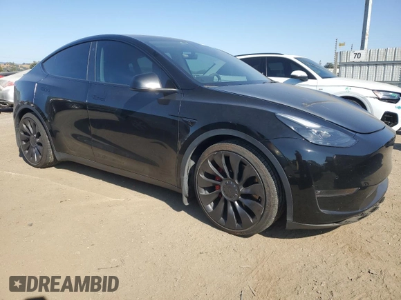 2022 Tesla Model Y Performance with VIN 7SAYGDEF1NF486218, listed as a Copart auction lot 63127435 with 99,302 mi miles and Salvage title. Bid and sale history available at DreamBid. Image 4.