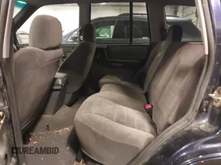 1997 Jeep Grand Cherokee Laredo with VIN 1J4GZ58S8VC675487, listed as a IAAI auction lot 41034046 with 243,284 mi miles. Bid and sale history available at carsss.com. Image 8.