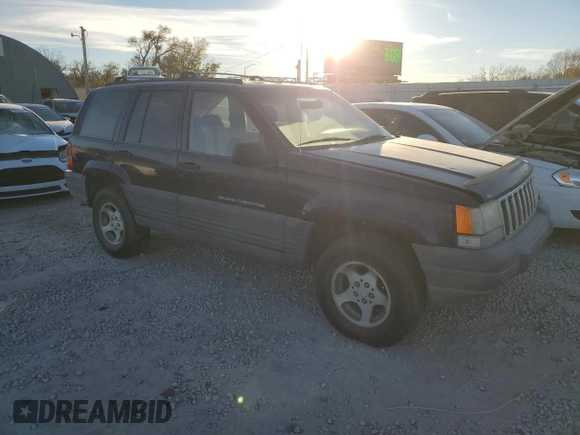 1997 Jeep Grand Cherokee Laredo with VIN 1J4GZ58S7VC685900, listed as a Copart auction lot 82105214 with 151,036 mi miles and Salvage Title. Bid and sale history available at carsss.com. Image 4.
