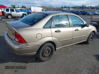 2004 Ford Focus SE with VIN 1FAFP34354W167961, listed as a IAAI auction lot 41545304 with 128,560 mi miles and . Bid and sale history available at DreamBid. Image 4.