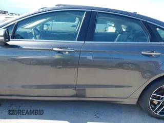 2019 Ford Fusion Titanium with VIN 3FA6P0D91KR104827, listed as a IAAI auction lot 42221526 with 141,316 mi miles and . Bid and sale history available at DreamBid. Image 14.