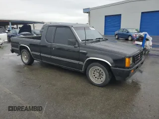 1991 Mitsubishi Mighty Max z VIN JA7FL25W7MP028365, wystawiony jako Copart lot #43964285 z przebiegiem 175 102 mil mil oraz Szkody całkowita. Historia ofert i sprzedaży dostępna na DreamBid. Obrazek 4.