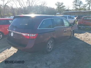 2012 Honda Odyssey EX-L with VIN 5FNRL5H60CB096691, listed as a IAAI auction lot 41824395 with 93,047 mi miles and . Bid and sale history available at DreamBid. Image 4.