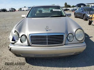 1999 Mercedes-Benz E-Class with VIN WDBJF65H5XA804902, listed as a Copart auction lot 73704634 with 92,411 mi miles and Salvage Title. Bid and sale history available at carsss.com. Image 5.