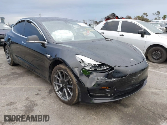 2019 Tesla Model 3 Mid Range with VIN 5YJ3E1EA6KF361808, listed as a IAAI auction lot 41767241 with 96,200 mi miles and . Bid and sale history available at carsss.com. Image 1.